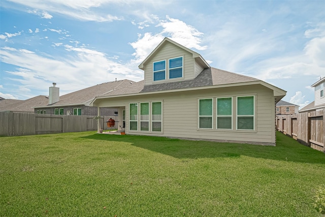 406 Riesling Dr, Alvin, TX 77511 - back of house with a fenced backyard and a shingled roof