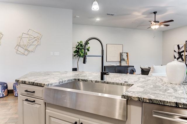 28723 Eden Creek Trl, Fulshear, TX 77441 - kitchen featuring light stone countertops, ceiling fan, stainless steel dishwasher, light wood-type flooring, and recessed lighting