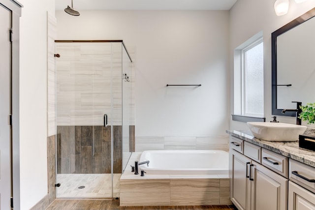28723 Eden Creek Trl, Fulshear, TX 77441 - bathroom with vanity, a garden tub, and a stall shower