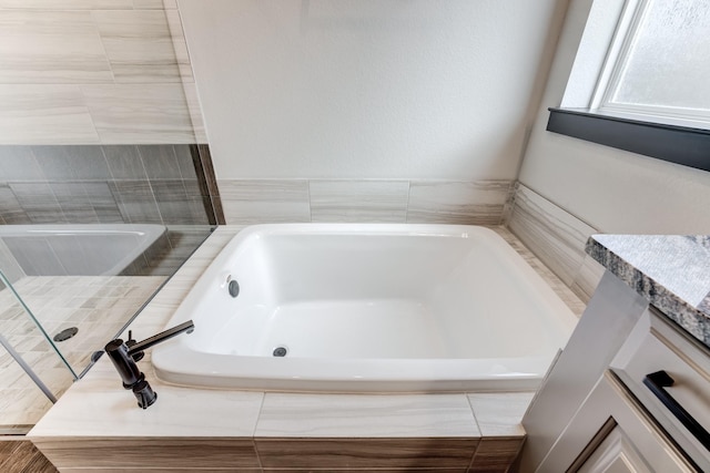 28723 Eden Creek Trl, Fulshear, TX 77441 - full bathroom with a garden tub and tiled shower