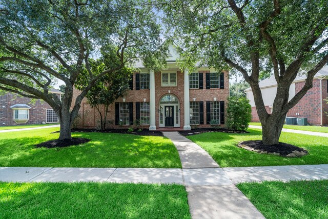 4919 Glen Hollow St, Sugar Land, TX 77479 - neoclassical / greek revival house with a front lawn and brick siding