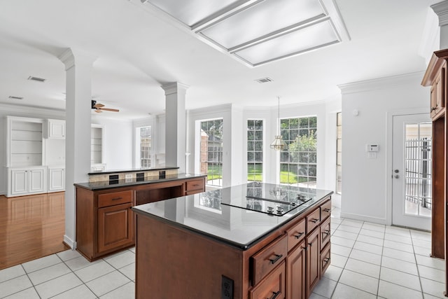 4919 Glen Hollow St, Sugar Land, TX 77479 - kitchen with ceiling fan, ornamental molding, light tile patterned flooring, decorative columns, and a center island