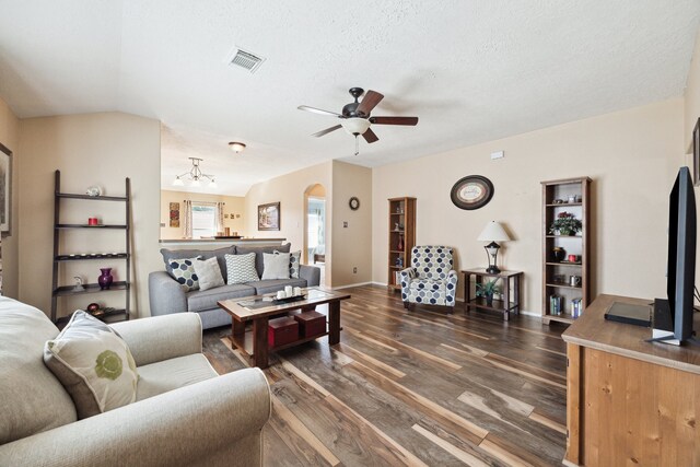 7238 Cypress Prairie Dr, Cypress, TX 77433 - kitchen with stainless steel appliances, under cabinet range hood, vaulted ceiling, light tile patterned floors, and decorative backsplash