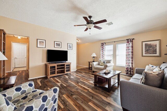 7238 Cypress Prairie Dr, Cypress, TX 77433 - living room with dark wood-type flooring, ceiling fan, and a textured ceiling