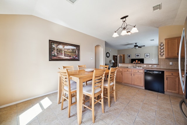 7238 Cypress Prairie Dr, Cypress, TX 77433 - dining room with ceiling fan, arched walkways, light tile patterned flooring, vaulted ceiling, and a chandelier