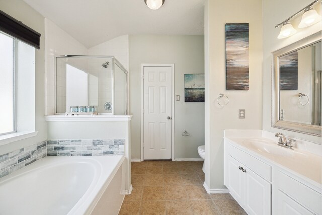 7238 Cypress Prairie Dr, Cypress, TX 77433 - bathroom with a bath, vanity, a stall shower, tile patterned floors, and vaulted ceiling