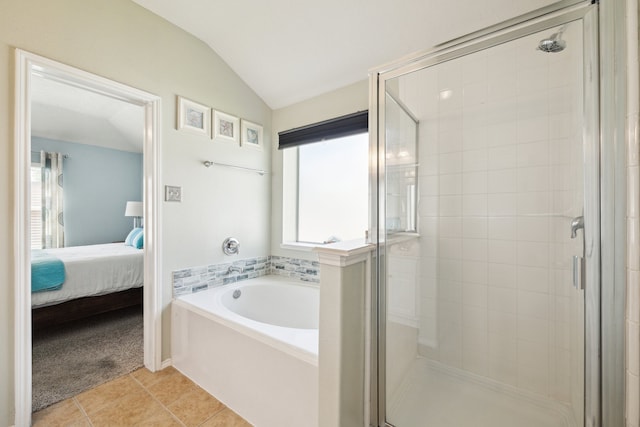 7238 Cypress Prairie Dr, Cypress, TX 77433 - full bath with ensuite bath, a bath, a stall shower, tile patterned floors, and lofted ceiling