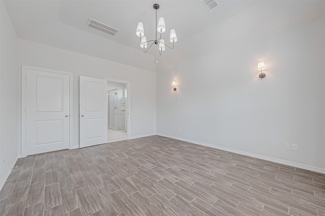 8934 Stanley Oak Dr, Missouri City, TX 77459 - spare room with light wood finished floors and a chandelier