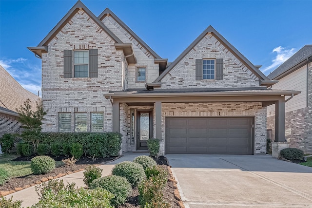 8934 Stanley Oak Dr, Missouri City, TX 77459 - traditional home featuring concrete driveway, an attached garage, and brick siding