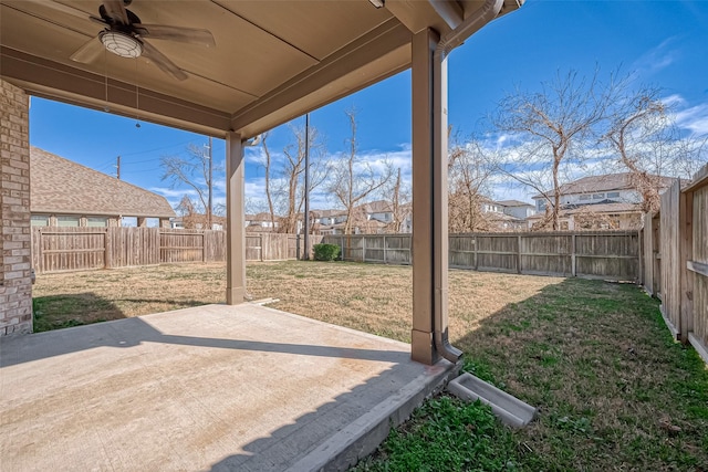 8934 Stanley Oak Dr, Missouri City, TX 77459 - fenced backyard with ceiling fan, a patio area, and a residential view
