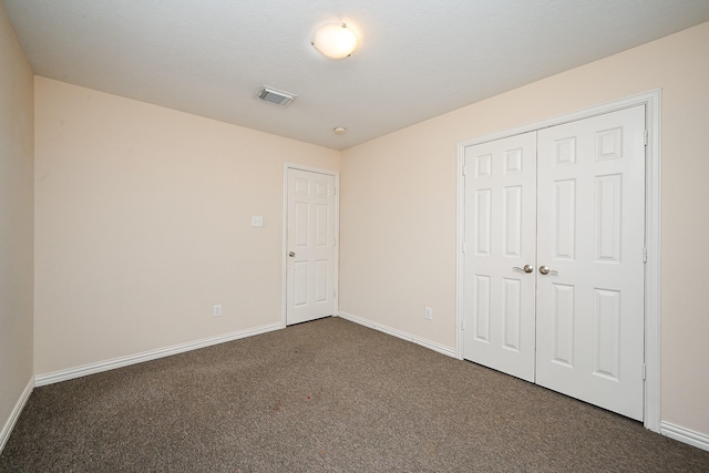 31 Crest Gate, Houston, TX 77082 - unfurnished bedroom with dark colored carpet and a closet