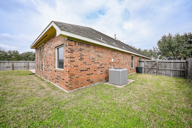 31 Crest Gate, Houston, TX 77082 - rear view of house featuring brick siding and a fenced backyard