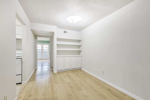 4500 Sherwood Ln Unit 8, Houston, TX 77092 - empty room with light wood-type flooring and a textured ceiling