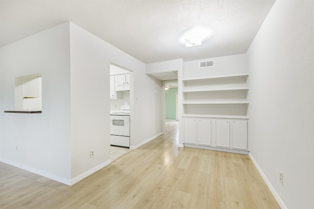 4500 Sherwood Ln Unit 8, Houston, TX 77092 - unfurnished room with light wood-style floors and a textured ceiling
