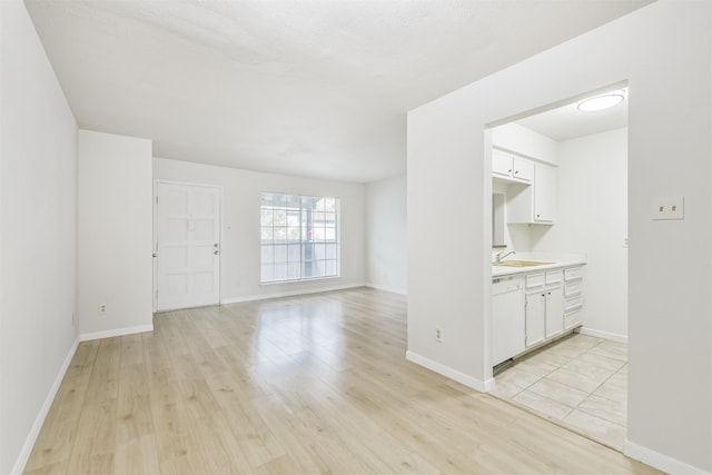 4500 Sherwood Ln Unit 8, Houston, TX 77092 - unfurnished living room featuring light wood-style floors and a sink