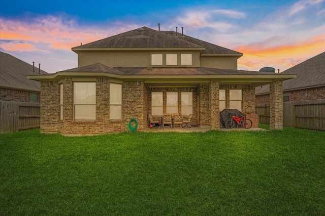 3823 Fleetwood Falls Ln, Spring, TX 77386 - rear view of property with a fenced backyard, a patio area, and brick siding