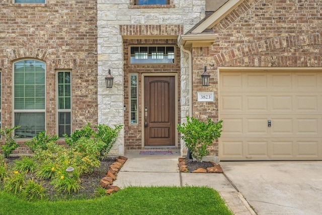 3823 Fleetwood Falls Ln, Spring, TX 77386 - doorway to property featuring a garage, stone siding, concrete driveway, and brick siding
