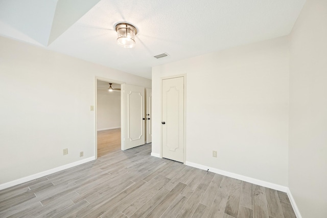 214 Caleta Cir, Richmond, TX 77406 - spare room featuring light wood-style flooring and baseboards