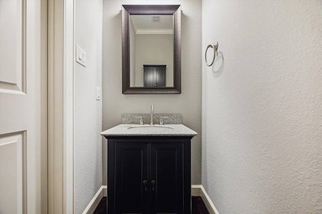 1707 Crockett St Unit A, Houston, TX 77007 - bathroom featuring ornamental molding, vanity, and a textured wall