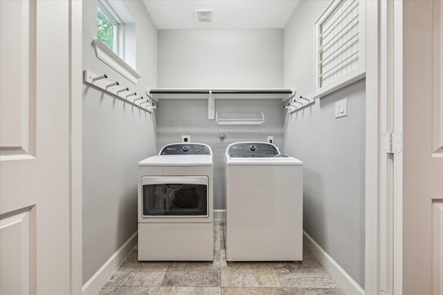 1707 Crockett St Unit A, Houston, TX 77007 - laundry area with washing machine and dryer and baseboards