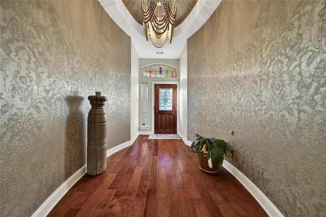 66 N Rocky Point Cir, Spring, TX 77389 - entryway featuring hardwood / wood-style floors, a chandelier, and wallpapered walls
