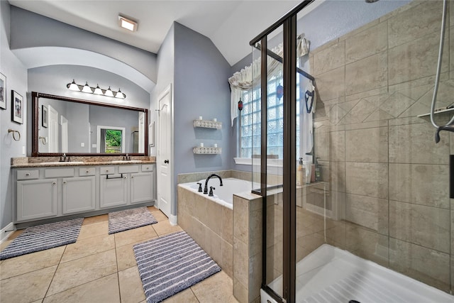 66 N Rocky Point Cir, Spring, TX 77389 - bathroom with a shower stall, a bath, double vanity, vaulted ceiling, and tile patterned flooring