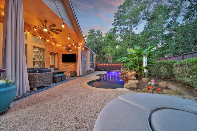 66 N Rocky Point Cir, Spring, TX 77389 - fenced backyard featuring a patio, ceiling fan, and an outdoor living space