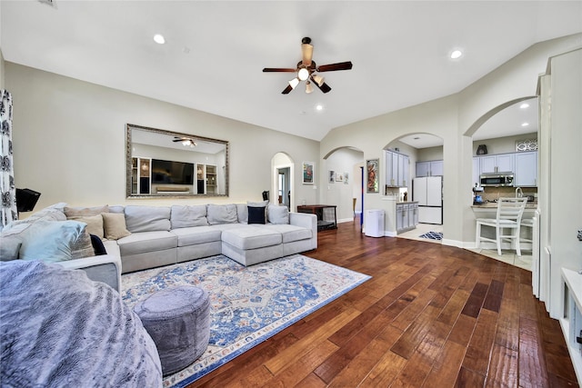 66 N Rocky Point Cir, Spring, TX 77389 - living area featuring a ceiling fan, arched walkways, lofted ceiling, dark wood finished floors, and recessed lighting