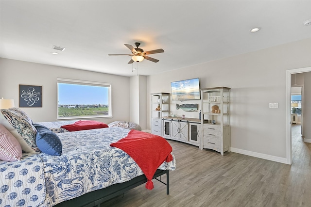 3914 Curlew Dr, Galveston, TX 77554 - bedroom with wood finished floors, ceiling fan, and recessed lighting