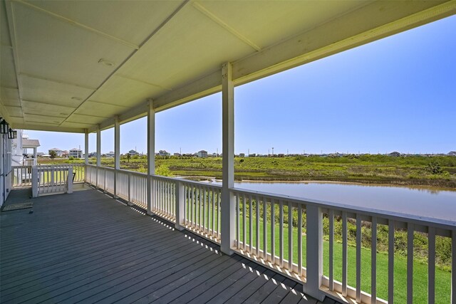 3914 Curlew Dr, Galveston, TX 77554 - wooden deck with a water view