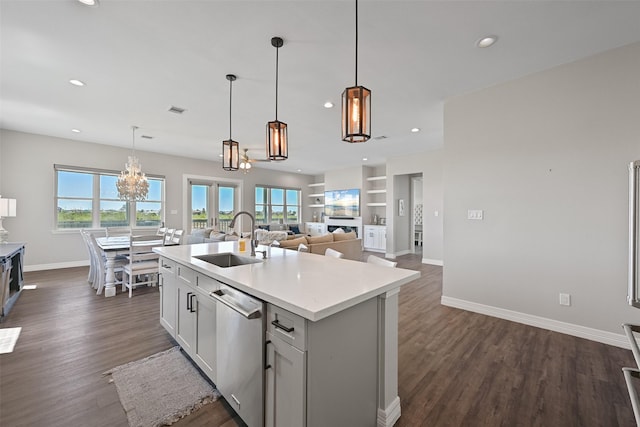 3914 Curlew Dr, Galveston, TX 77554 - kitchen with dishwasher, a chandelier, recessed lighting, light countertops, and a center island with sink