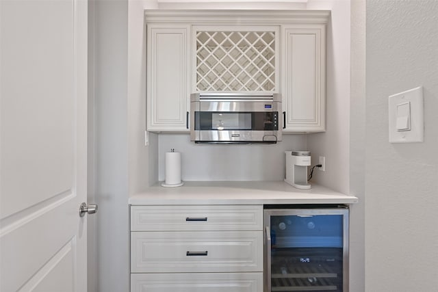 3914 Curlew Dr, Galveston, TX 77554 - indoor dry bar featuring wine cooler and stainless steel microwave