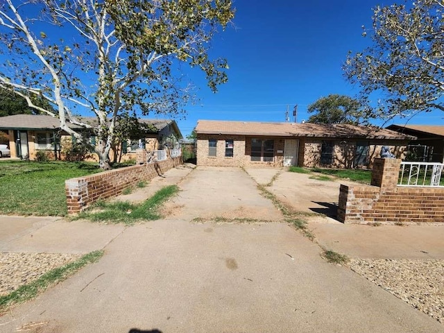 1807 E 1st St, Lubbock, TX 79403 - single story home with brick siding