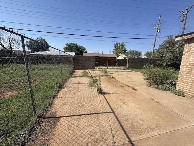 1807 E 1st St, Lubbock, TX 79403 - fenced backyard with a patio