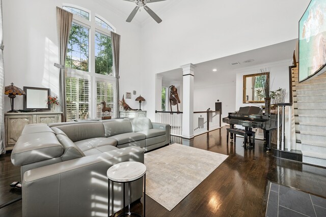 2516 Bagby St, Houston, TX 77006 - living area featuring a high ceiling, a ceiling fan, wood finished floors, plenty of natural light, and ornamental molding