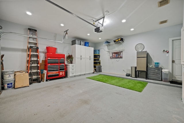 2516 Bagby St, Houston, TX 77006 - garage with freestanding refrigerator, recessed lighting, and a garage door opener