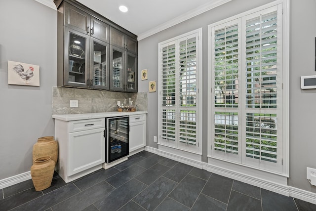 2516 Bagby St, Houston, TX 77006 - indoor dry bar with beverage cooler, crown molding, and decorative backsplash
