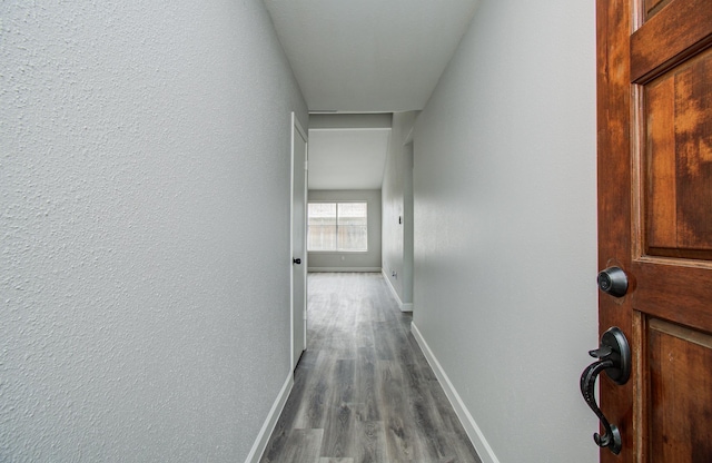 2207 S Ferrisburg Ct, Sugar Land, TX 77478 - hallway featuring baseboards and dark wood-type flooring