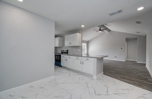 2207 S Ferrisburg Ct, Sugar Land, TX 77478 - kitchen featuring range with electric cooktop, ceiling fan, white cabinets, recessed lighting, and open floor plan