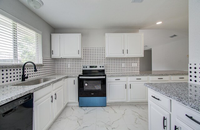 2207 S Ferrisburg Ct, Sugar Land, TX 77478 - kitchen with range with electric stovetop, dishwasher, white cabinetry, light stone counters, and backsplash