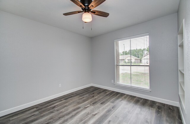 2207 S Ferrisburg Ct, Sugar Land, TX 77478 - empty room featuring dark wood-style flooring and ceiling fan