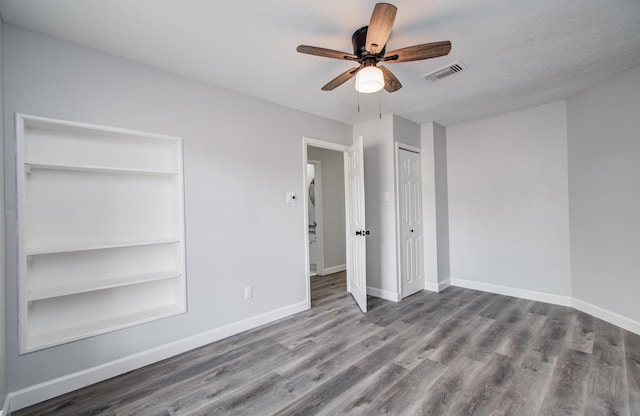 2207 S Ferrisburg Ct, Sugar Land, TX 77478 - unfurnished bedroom with wood finished floors and a ceiling fan