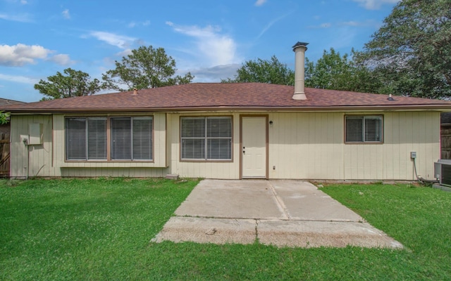 2207 S Ferrisburg Ct, Sugar Land, TX 77478 - rear view of house with a patio, a yard, and roof with shingles