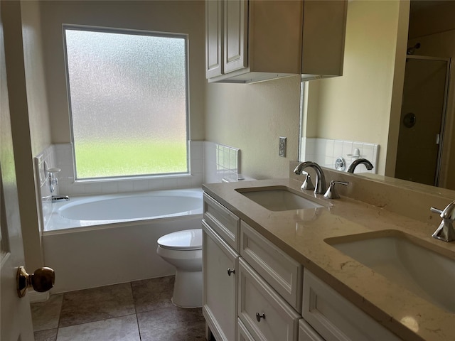 6830 Silver Shores Ln, Katy, TX 77449 - full bathroom featuring a bath, double vanity, and a shower stall