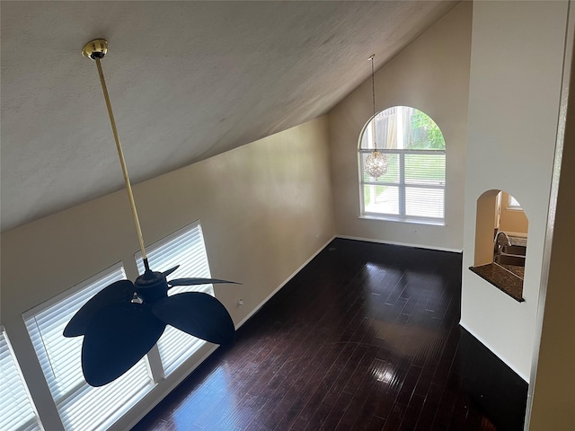 6830 Silver Shores Ln, Katy, TX 77449 - detailed view of wood finished floors, arched walkways, and a textured ceiling