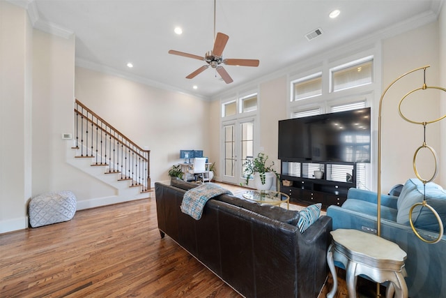 1753 Upland Lks, Houston, TX 77043 - living area with wood finished floors, a ceiling fan, crown molding, stairway, and plenty of natural light