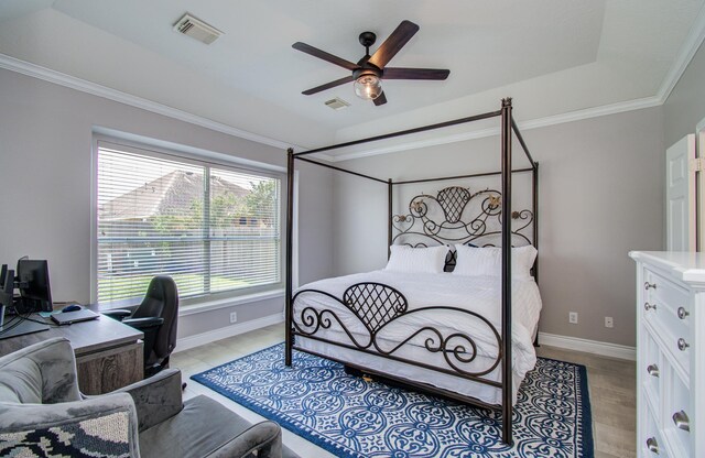12807 Sienna Trails Dr, Tomball, TX 77377 - bedroom with crown molding, a desk, and a ceiling fan