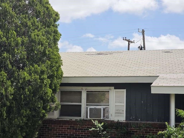 2704 E Colgate St, Lubbock, TX 79403 - exterior view of a shingled roof, brick siding, and cooling unit