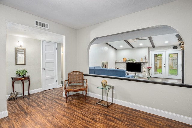 5427 Cairnleigh Dr, Houston, TX 77084 - living area featuring arched walkways, wood finished floors, a ceiling fan, beam ceiling, and recessed lighting