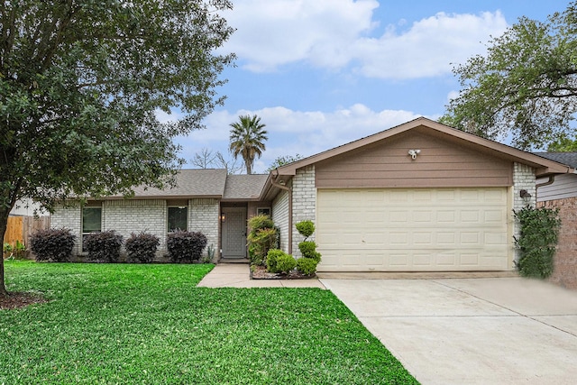 5427 Cairnleigh Dr, Houston, TX 77084 - single story home featuring concrete driveway, an attached garage, a front yard, brick siding, and roof with shingles